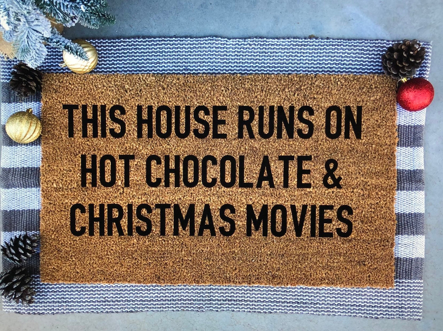 this house runs on hot chocolate and christmas movies doormat