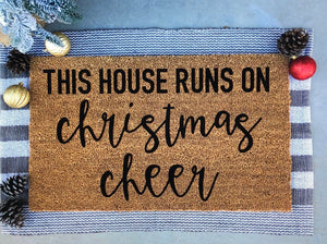 this house runs on christmas cheer doormat