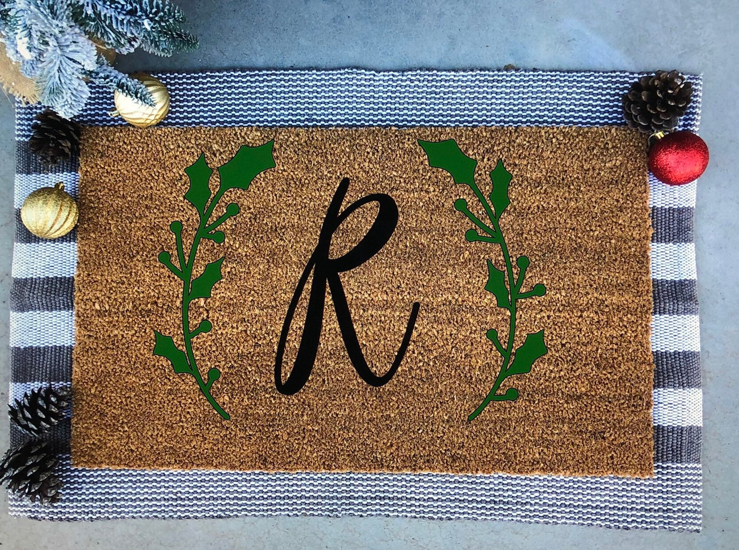 custom letter with christmas greenery doormat