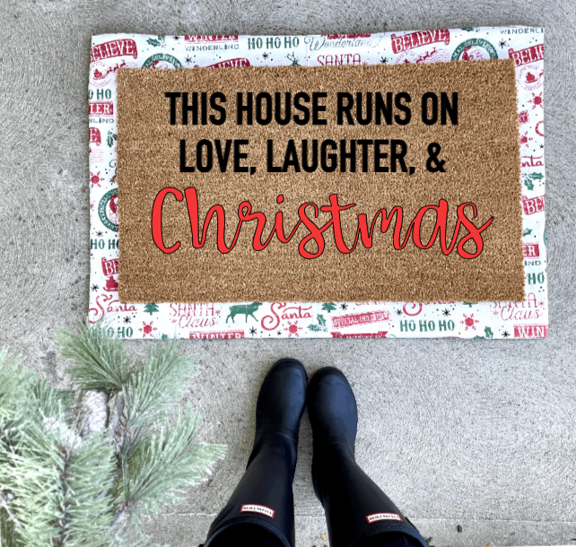 This house runs on love laughter and Christmas doormat